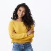 Happiness, wellbeing and confidence concept. Cheerful attractive african american woman curly haircut, cross arms chest in self-assured powerful pose, smiling determined, wear yellow sweater.